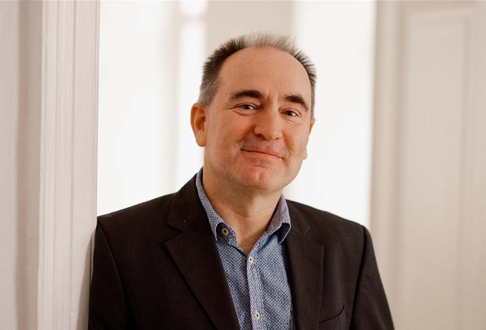 Portrait of Martin Kampel with a soft smile